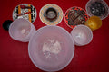 Decorative plates with artistic designs on a red surface